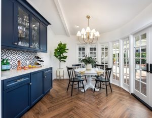 Dining room with French doors and French door size windows leading to the back yard and pool area