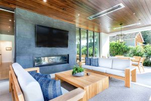 Indoor-outdoor living spaces with fireplace and television
