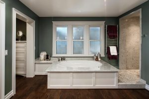 Spa Bathtub with windows allowing natural light in. 