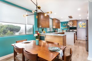 Dining room area with a teal painted wall