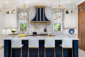 Blue, gold, and white luxury kitchen with a blue and gold kitchen hood.
