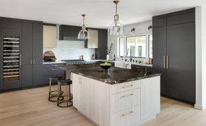 Black cabinets, light wood island, two-tone kitchen, contemporary kitchen remodeled by Zieba Builders